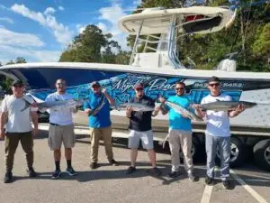 Myrtle Beach sport fishing charter group with their catch in Murrells Inlet, SC