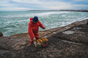 Fisherman preparing tackle for fall king mackerel run on South Carolina coast.